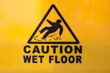 How do warning signs impact my slip and fall claim